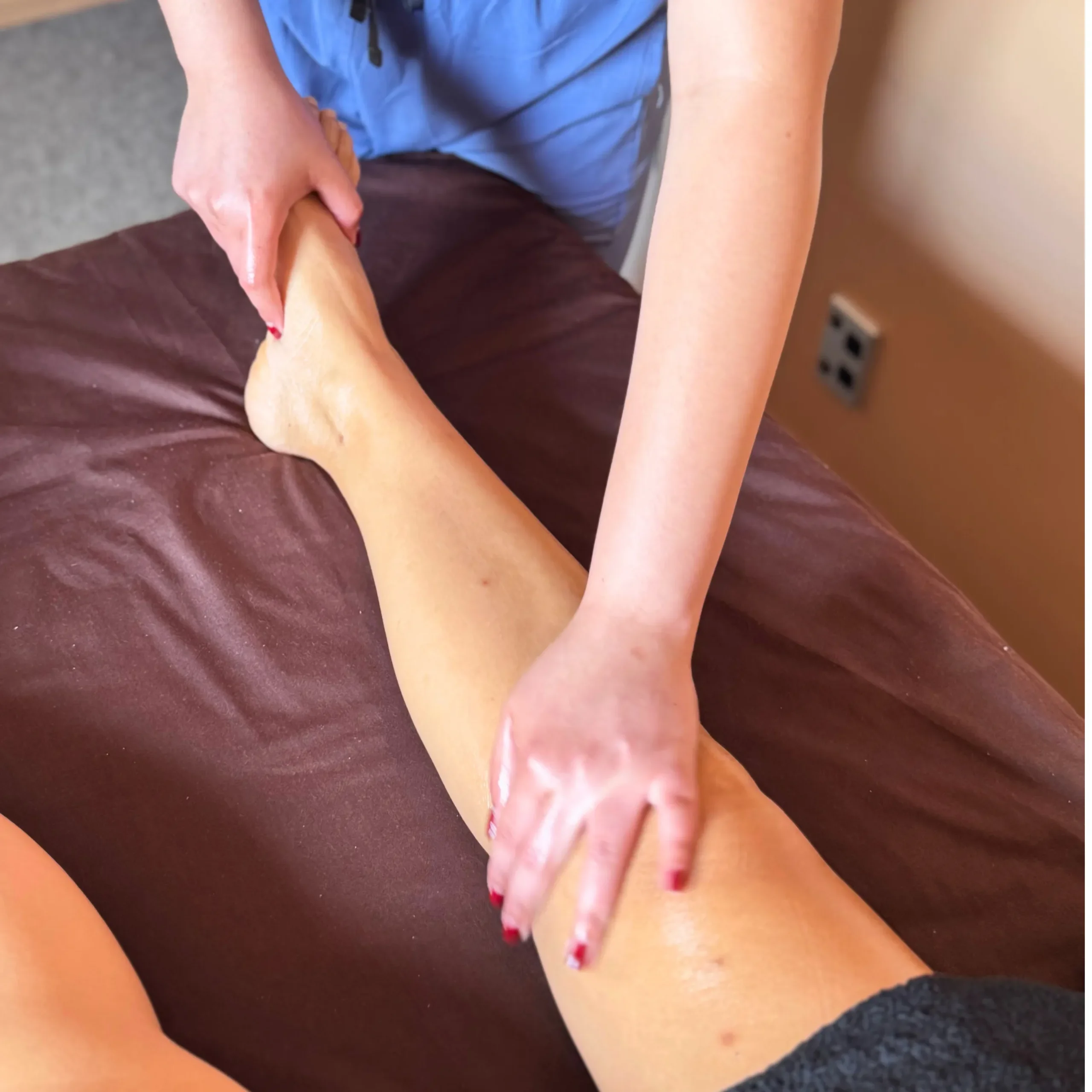 A photo of Kitty doing leg massage