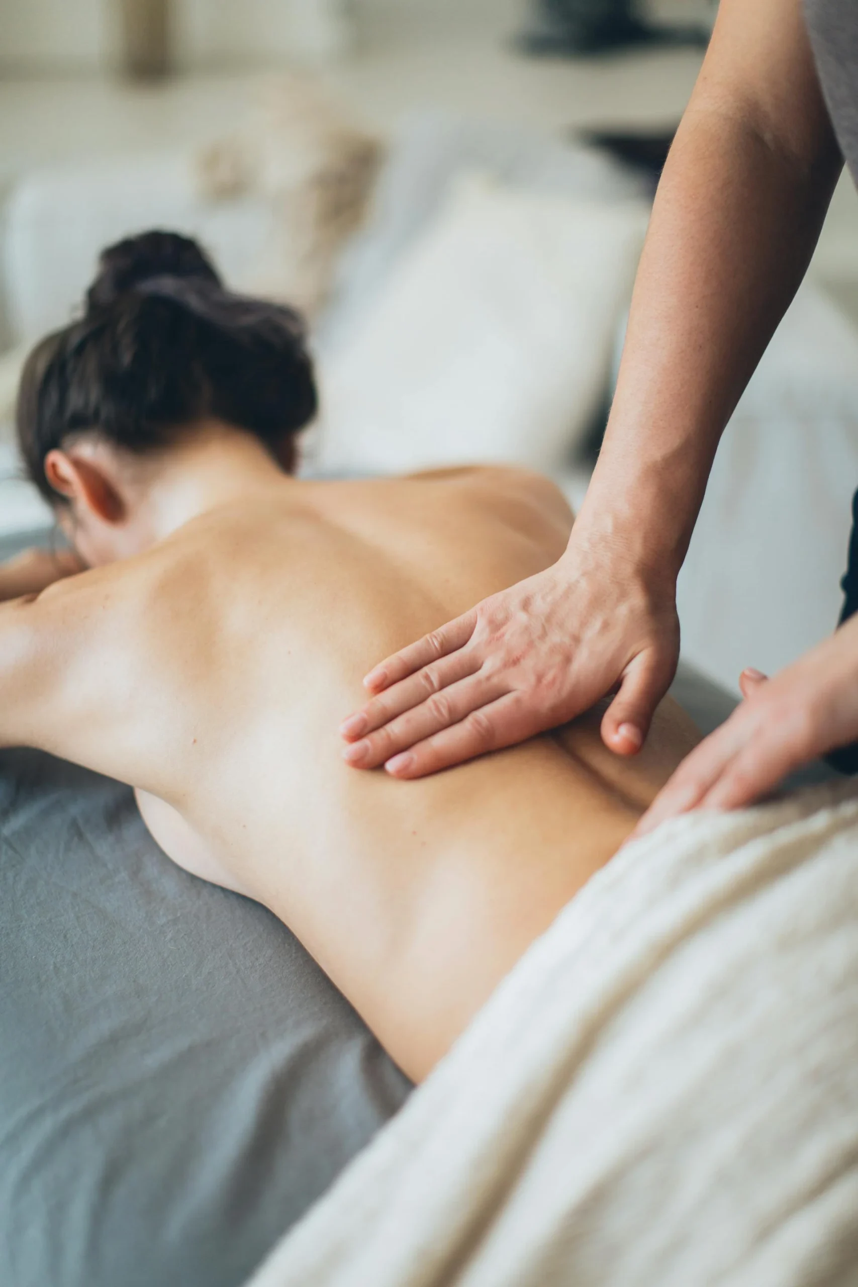 photo of woman getting a back massage